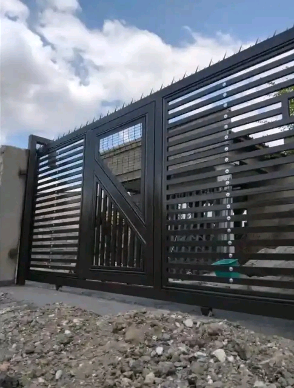 Custom steel security gate with anti-climb spikes