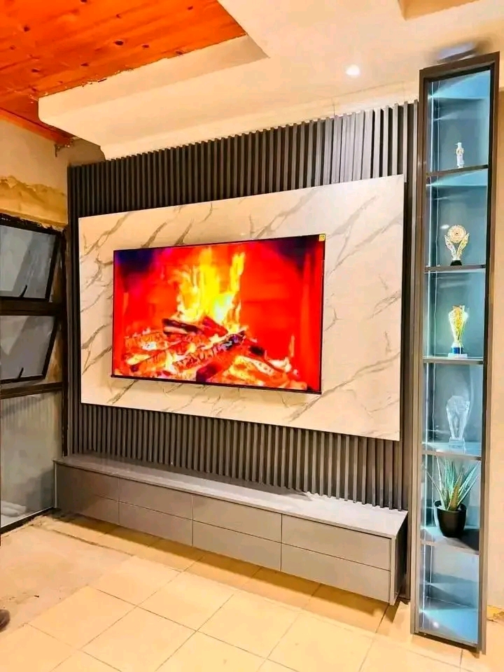 Fireplace-effect TV feature wall with display column